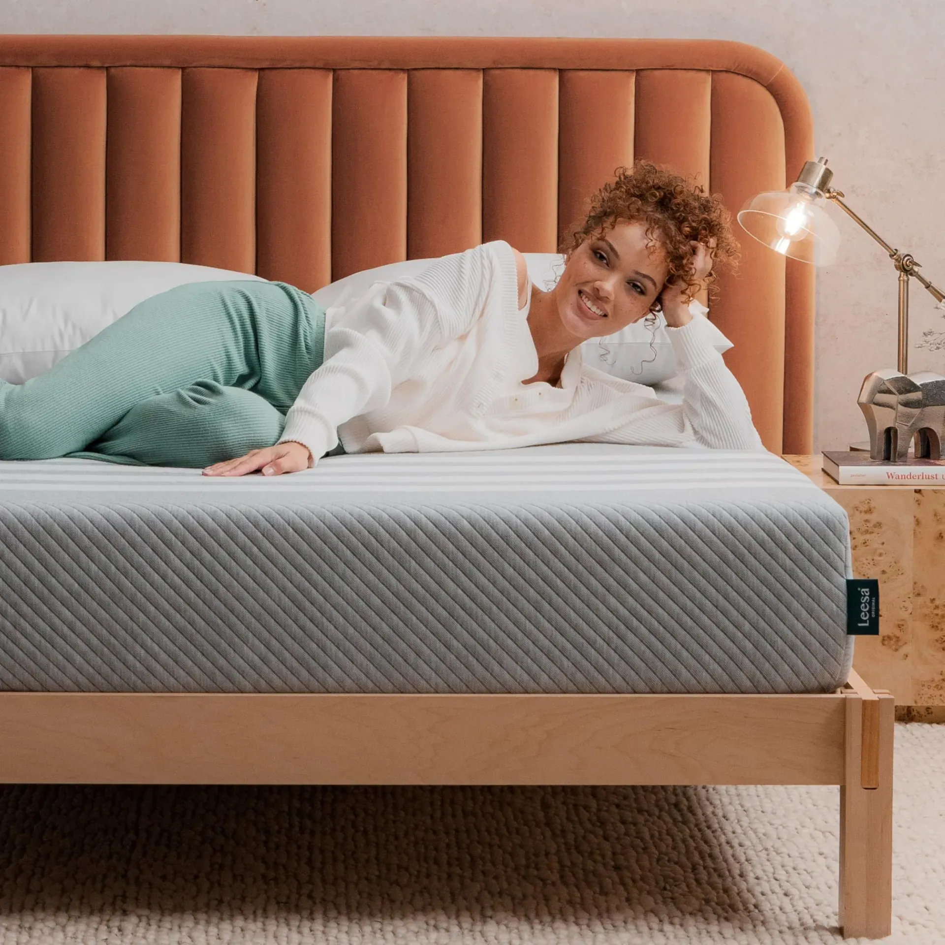 Leesa Original all-foam mattress with signature four-stripe cover in modern bedroom