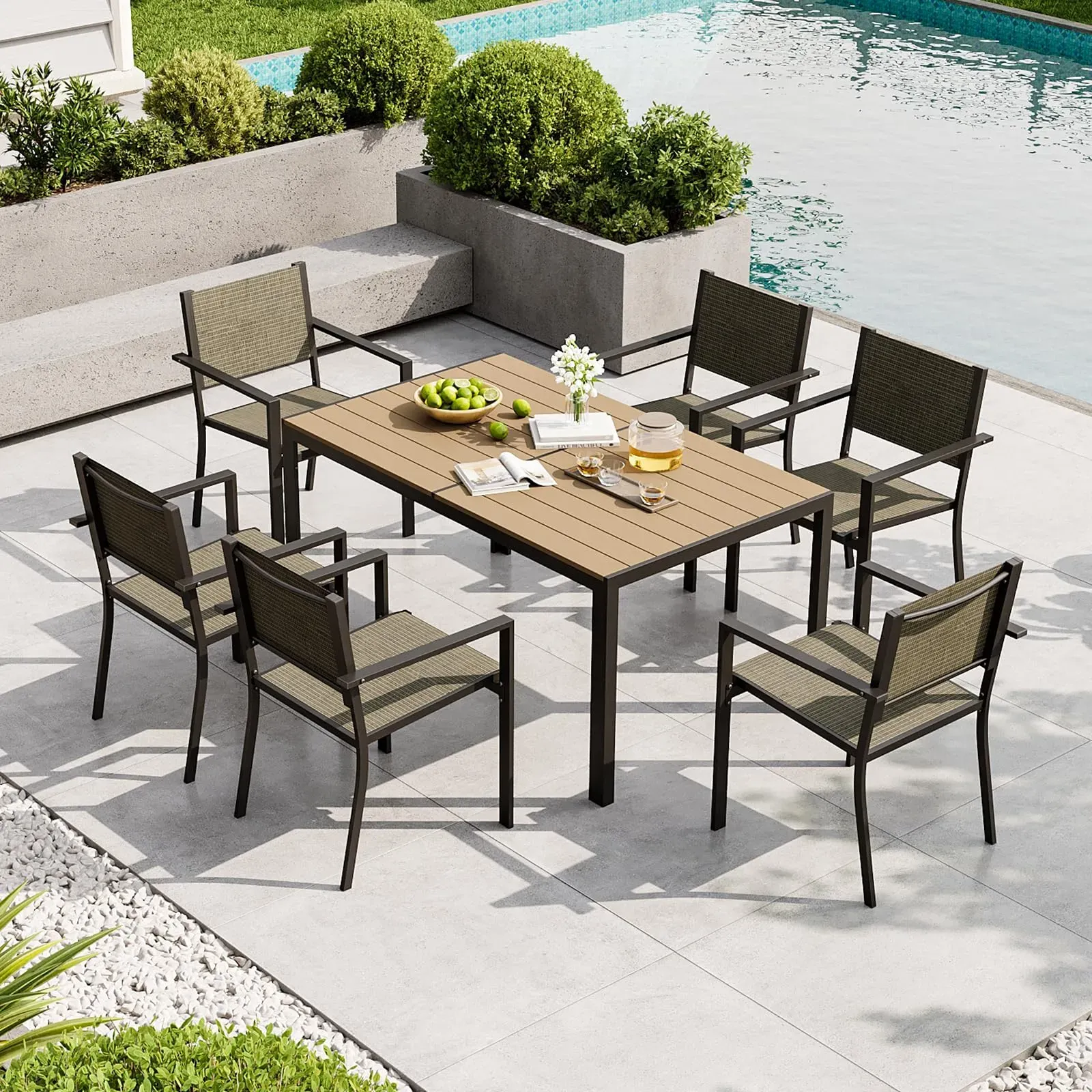 Aoxun 7-piece patio dining set with six Textilene chairs and large metal table on a deck