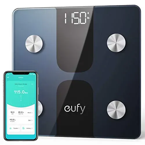 eufy Smart Scale C1 with 4.3-inch color TFT display showing weight trend graph on bathroom floor