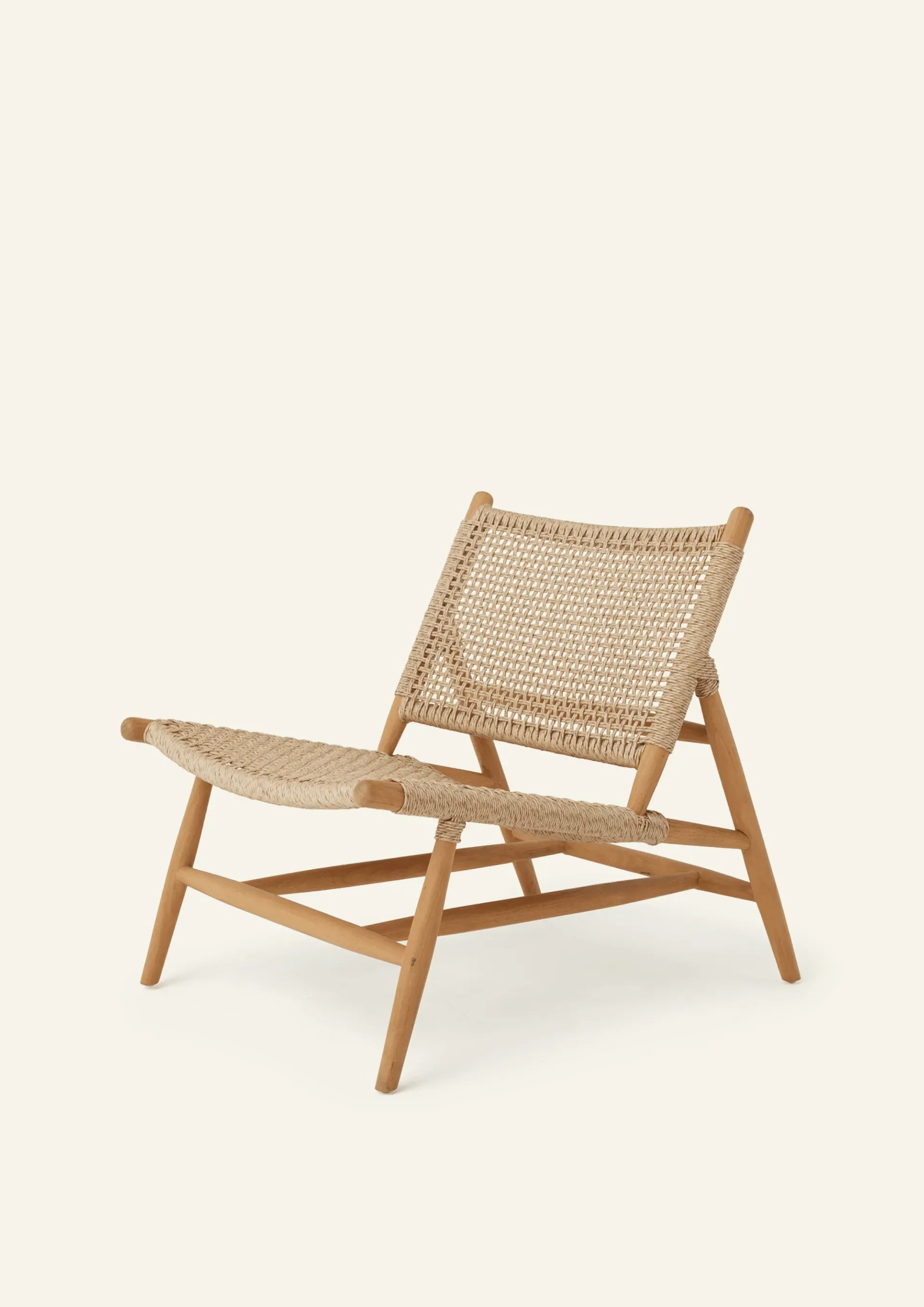 Hati Home Bali Lounge Chair in solid A-grade teak on a tropical patio