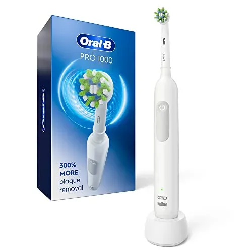 Oral-B Pro 1000 rechargeable electric toothbrush with round oscillating brush head on charging base