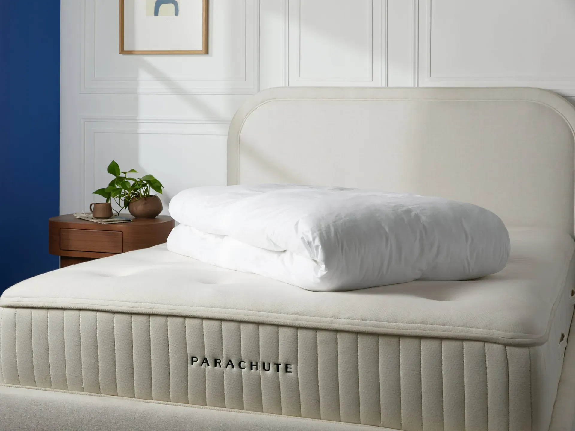 Parachute Down Mattress Topper with cotton sateen cover on a luxury bed