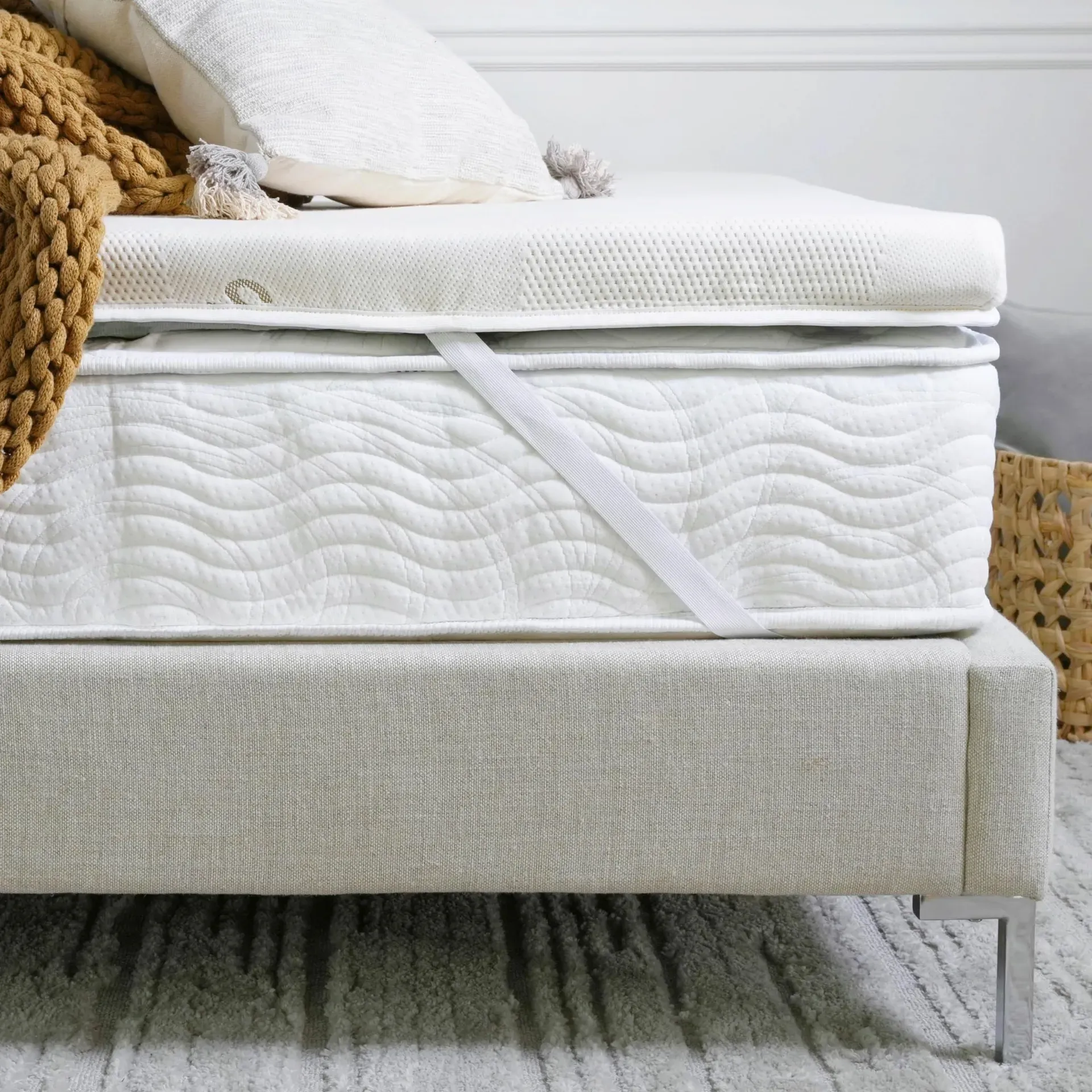 Saatva Graphite Memory Foam Mattress Topper with cooling graphite infusion on bed