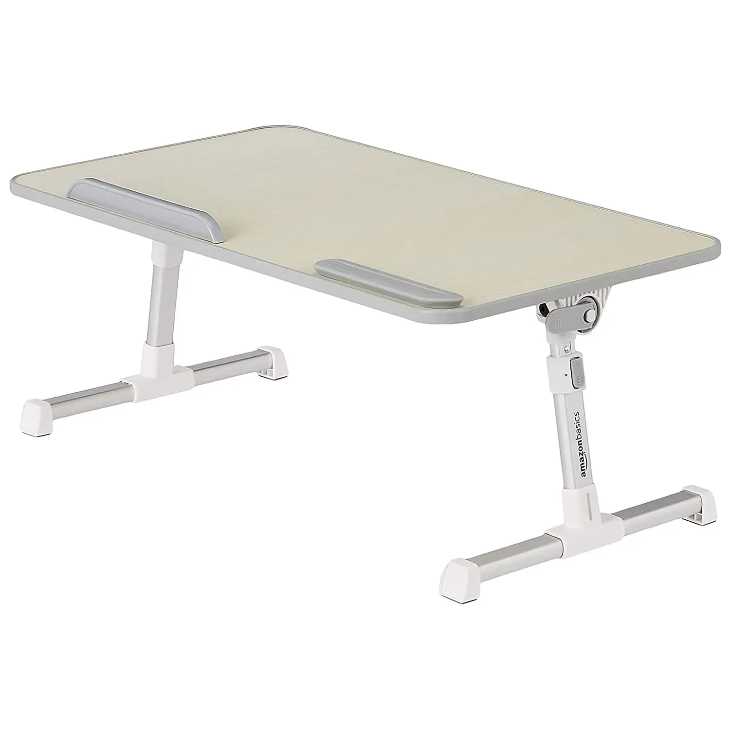 Amazon Basics adjustable ergonomic laptop stand with retractable legs and large aluminum surface on a bed