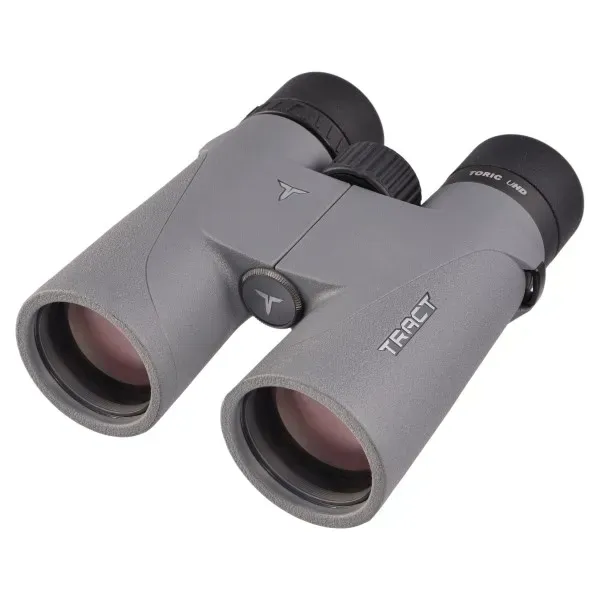 Tract Toric UHD 10x42 binoculars with Schott HT high-transmission glass on mossy ground